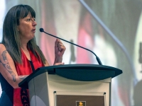 Conference co-organizer Charlene Bearhead introduces keynote speaker Lisa Howell during Giga Maamaawii bimosemin/We Will Walk Together: A Conference for Truth and Reconciliation held on Monday, Sept. 26.