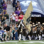 Bisons Football team charges onto the field