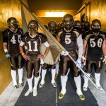 Bison Football players standing in a tunnel