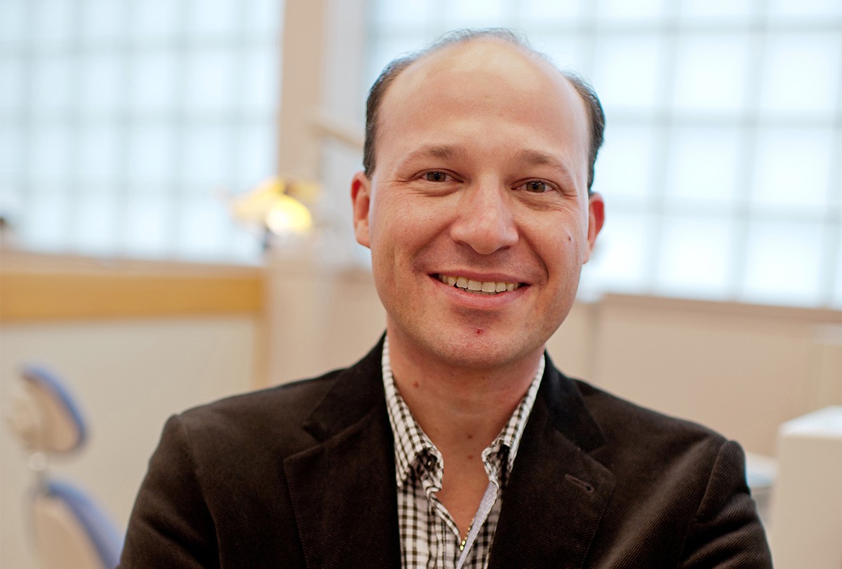 Dentistry professor Robert Schroth brightens smiles in the community.