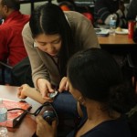 Medicine student Dorothy Yu and EAL program student Helen Ghebreigziabher participate in a collaborative skills night organized by the Immigrant and Refugee Health Group