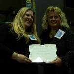 Chelsea Jalloh, left, holds her Emerging Leader Award with Dawn Wallin, associate dean of graduate studies in the Faculty of Education.