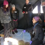 A CEOS scientist demonstrates plankton sampling in the water column.