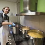 Darby Cumming volunteering at the Ma Mawi Wi ChiItata Centre during his service learning experience.