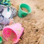 child playing in sand
