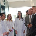 Students Daniell McAllister, Chris Cadonic, Taylor Morriseau, Ella Thomson, and Kevin Champagne-Jorgenson in the Albensi lab talk with Benedict Albensi and Minister Kevin Chief // Photo by Rebecca Krowelski
