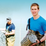 Jonathan Challis, PhD student in Chemistry, collecting water samples. // Photo by Ian McCausland