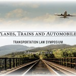 a plane flying over train tracks