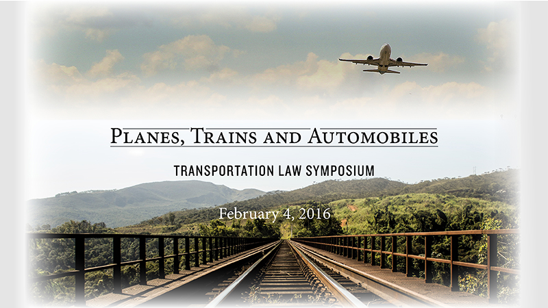 a plane flying over train tracks