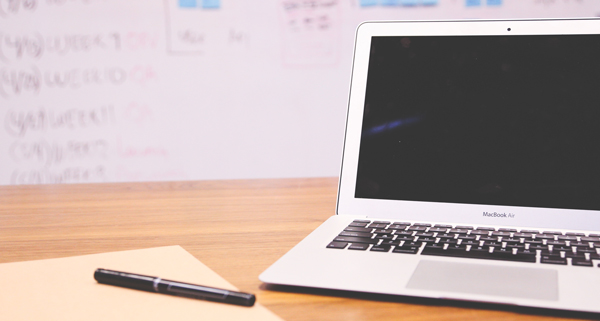 pen, paper and laptop