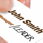 Business card that says "Manager/Leader"