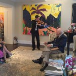 Alumni at the reception in New York on June 9, 2016 with Desautels Faculty of Music student Gregory Lewis playing violin.