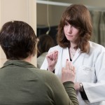 Dr. Ruth Ann Marrie meets with a patient.