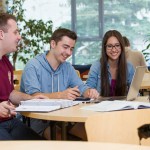 Students study inside Migizii Agamik - Bald Eagle Lodge.