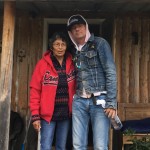 Evelyn Baxter, Charlie Wenjack’s sister, with Gord Downie outside her home in Ogoki Post, Ont. // PHOTO: Grand Chief Alvin Fiddler