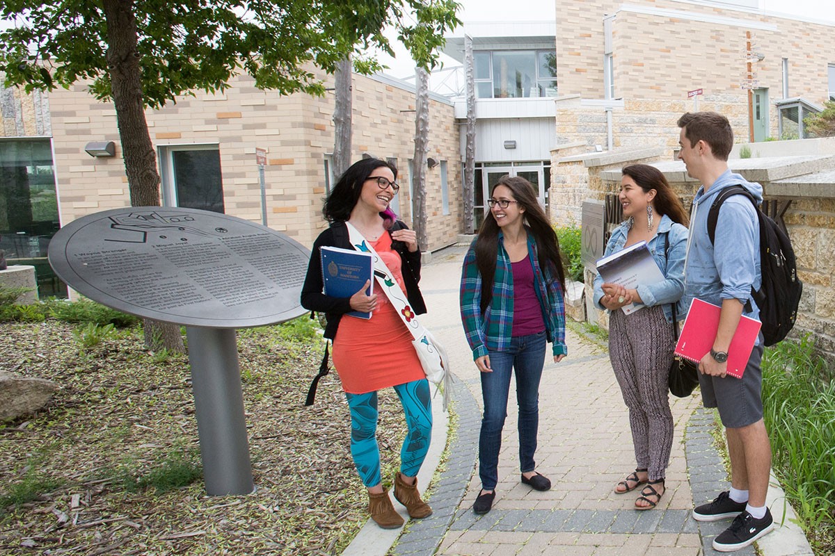 Students outside MIGIZII AGAMIK (Bald Eagle Lodge).