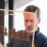 Michael Sampson examines a papyri in teh University of Michigan's collection // Photo: Monica Tsuneishi