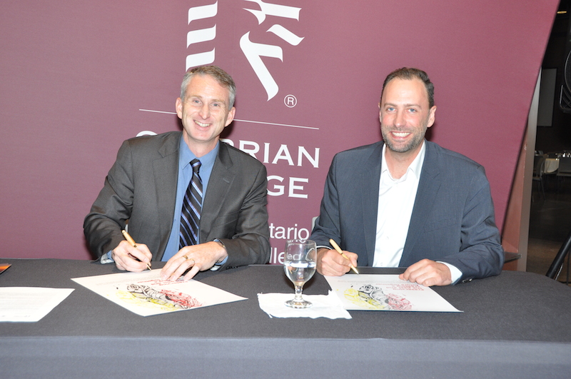 Cambrian College President Bill Best and National Centre for Truth and Reconciliation (NCTR) Director Ry Moran affirm a new partnership between the College and the Centre.