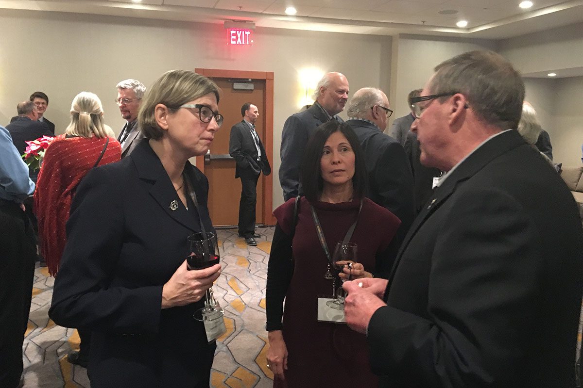 Dr. Annemieke Farenhorst engaged in conversation with University of Manitoba alumni at the Calgary reception.