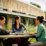 Students outside Migizii Agamik - Bald Eagle Lodge.