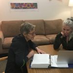 Julie Guard, labour studies program coordinator, works with a student in the program's resource room