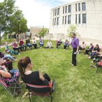 DURING LIVE WELL @ WORK WEEK THIS PAST JUNE, FACULTY AND STAFF ATTEND A MEDICINE WHEEL TEACHINGS WORKSHOP LED BY UNIVERSITY ELDER-IN-RESIDENCE NORMAN MEADE OUTSIDE MIGIZII AGAMIK - BALD EAGLE LODGE.