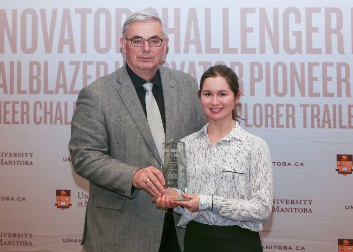 U of M President David Barnard with Rachel Nickel, winner of the 2017 3MT competition.
