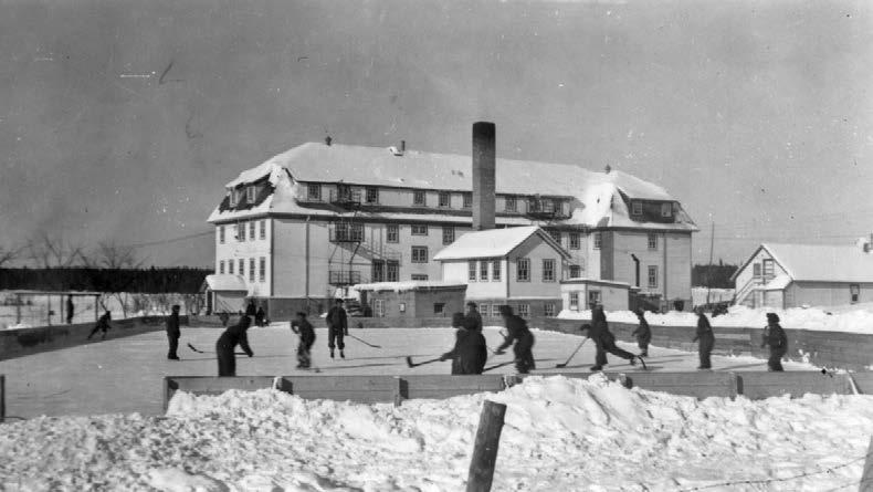 Boys playing hockey at the McIntosh, Ontario, school. Many students said that they would not have survived their residential school years, were it not for sports. St. Boniface Historical Society, Oblates of Mary Immaculate, Manitoba Province Fonds, SHSB 29362.