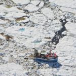 A crab fishing boat trapped in the multiyear sea ice off the Newfoundland coast. Credit: David G. Barber.