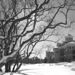 Admin building on campus in black and white photo.