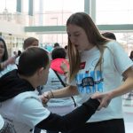 A student dances with a man