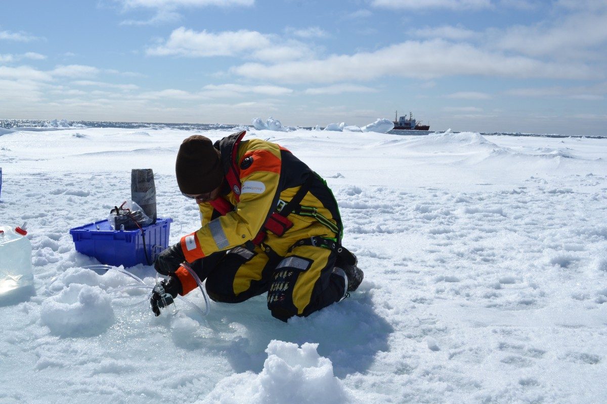 David Capelle sampling water // Photo: L.Dalman
