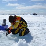 David Capelle sampling water // Photo: L.Dalman