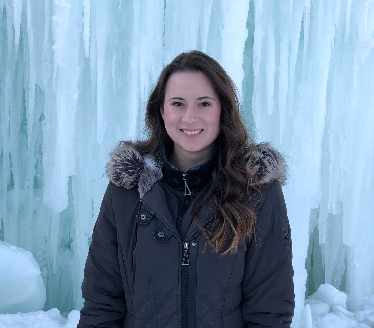 Photo of Taylor Nimchonok with ice-wall in the background