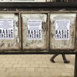 Image of multiple posters promoting a Basic Income government project.