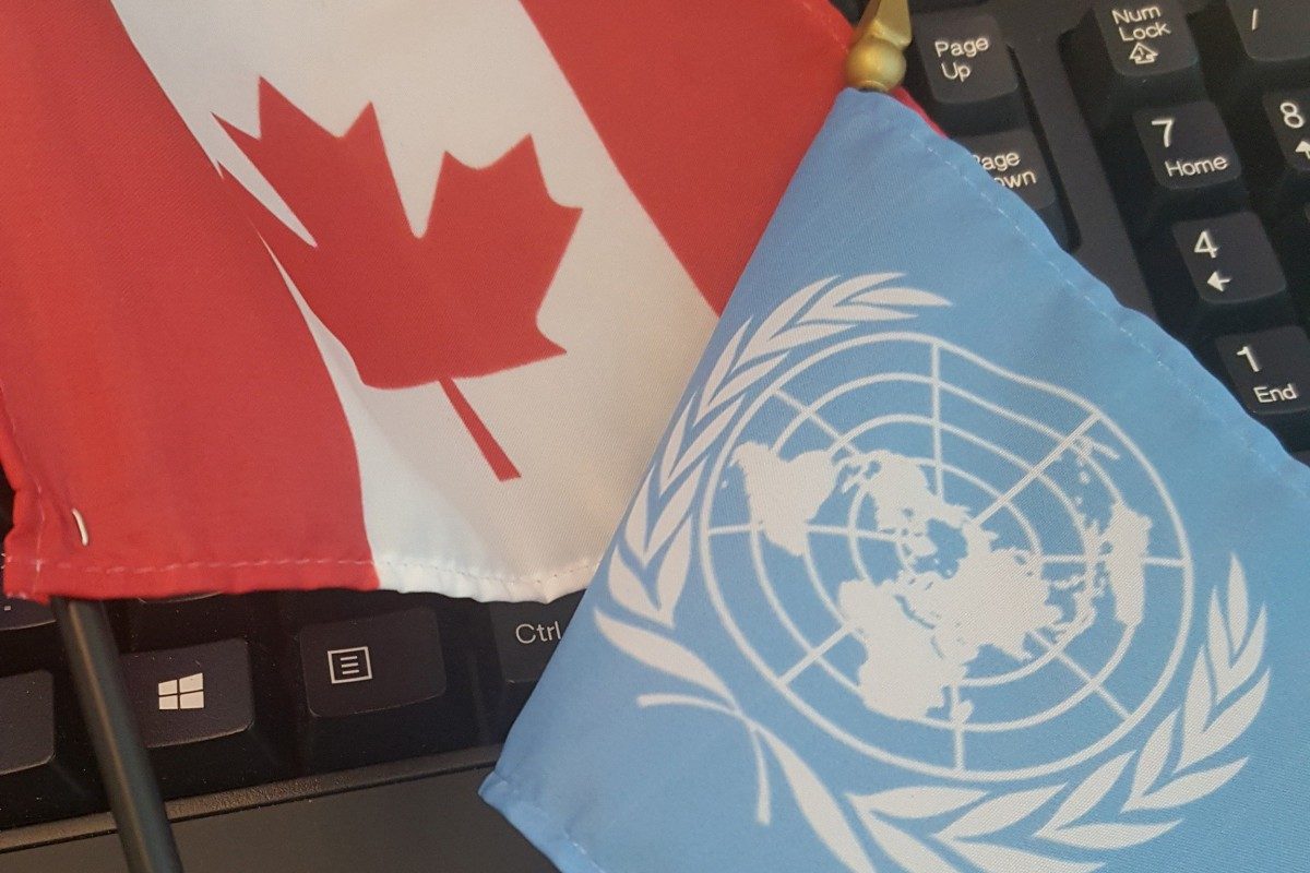 The Canadian and United Nations flags