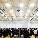 Grads line up backstage for Convocation in June 2018.