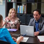 Staff members at computer