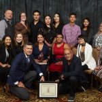 Christa Bruneau Guenther (middle row, third from the left) poses with VIBE Award and Feast Café Bistro staff.