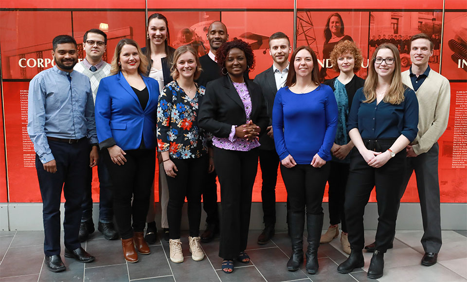 LLM student Ihsan Daldaban (2nd from left, back row) with Heat 1 3MT challenge participants.