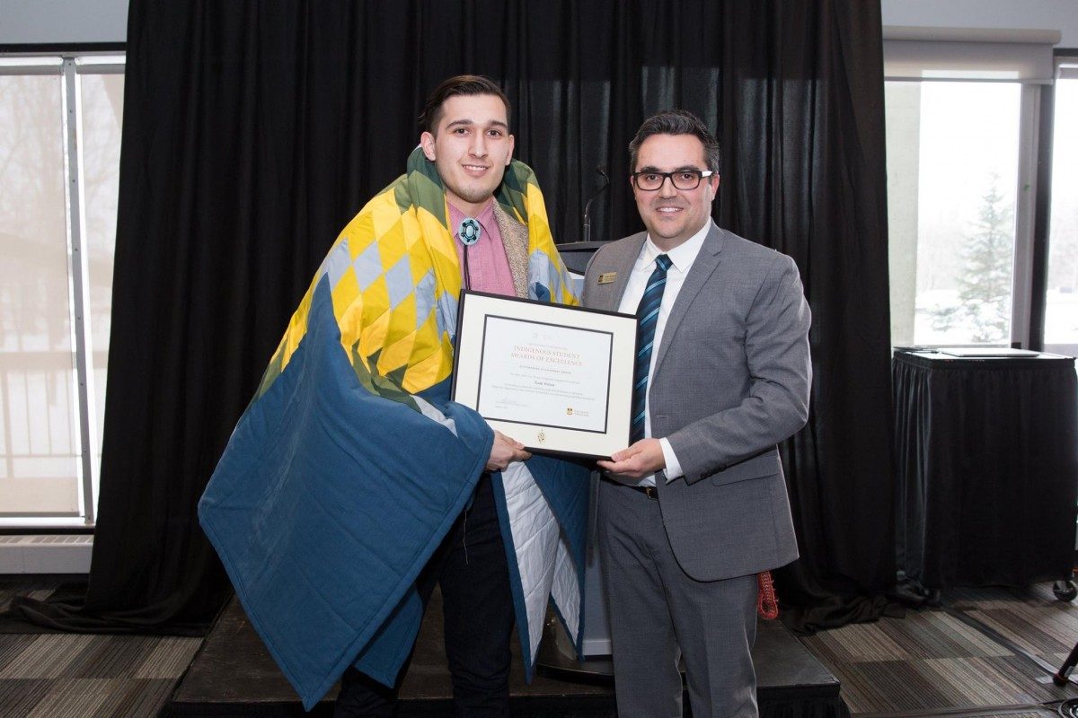 Noah Wilson (left) receiving an Indigenous Student Award of Excellence