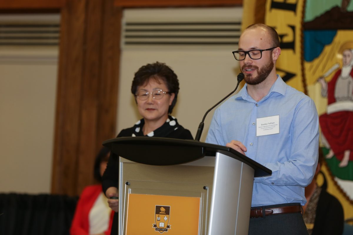 Bradley Feltham awarded U of M's Dr. Miyoung Suh.