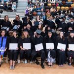 Extended Education grads including Bonnie Murray, in her Indigenous graduation scarf, celebrate their moment.