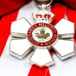 mage from the office of the Governor General of Canada: The insignia of the Order is a stylized snowflake of six points, with a red annulus at its centre which bears a stylized maple leaf circumscribed with the motto of the Order: DESIDERANTES MELIOREM PATRIAM–Latin for “They desire a better country”.