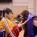 Grandmother-in-Residence Lorraine Cameron-Munro and a student at the 30th Annual Traditional Graduation Pow Wow in May.