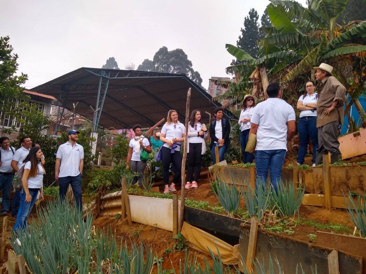 Students visiting local health advocate in La Cruz. He and his family grow food for the community