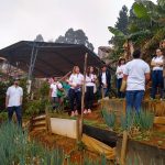 Students visiting local health advocate in La Cruz. He and his family grow food for the community