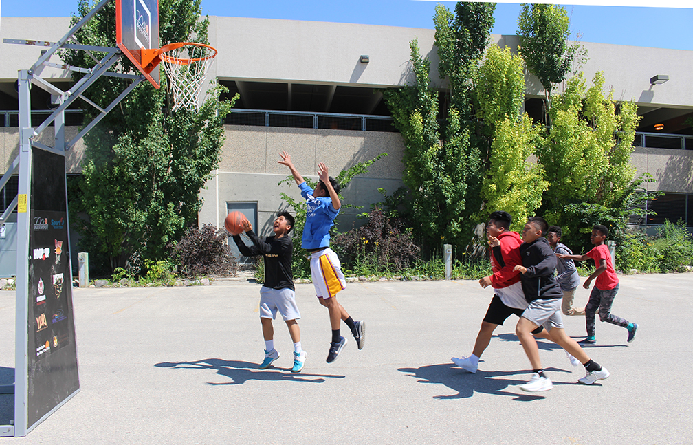 Basketball takes over parking lot E on the Bannatyne campus during the summer.