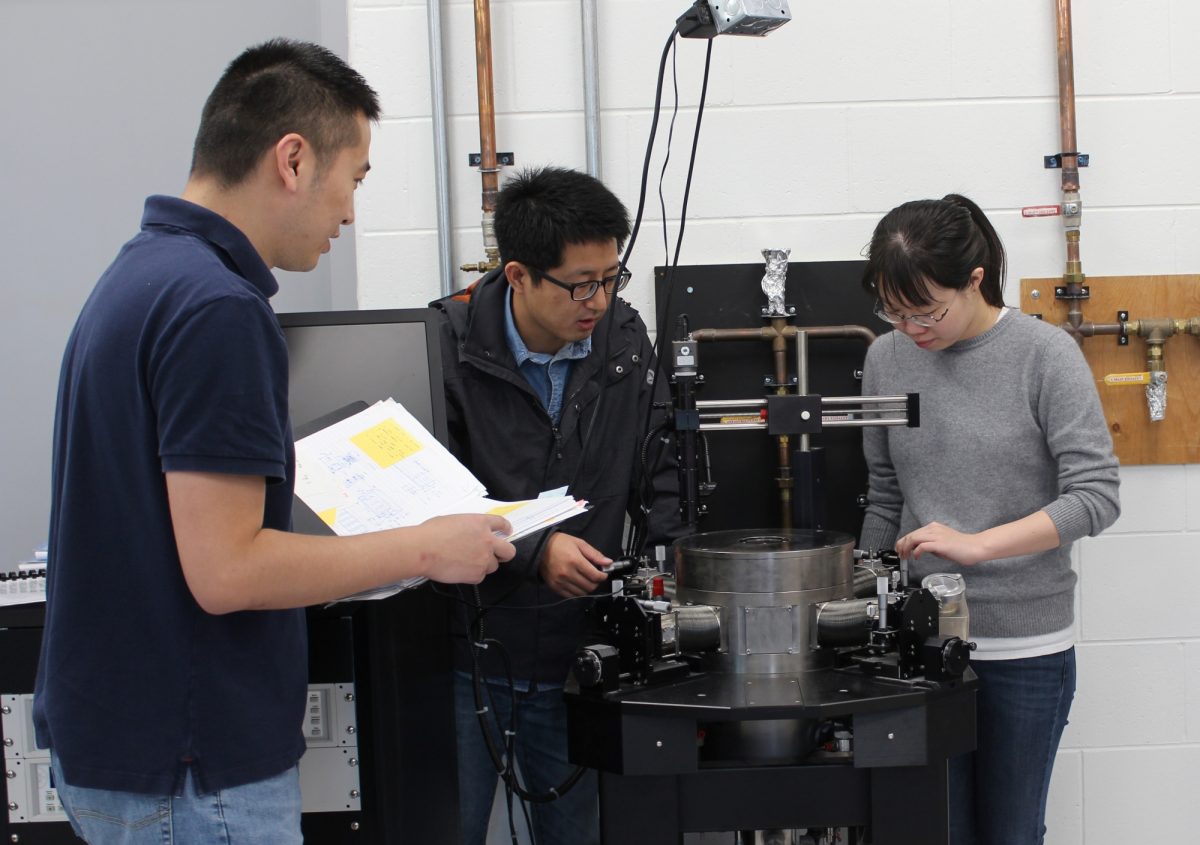 Dr. Yipu Wang, with PhD students Jinwei Rao, Ying Yang discuss their microwave discovery