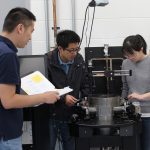 Dr. Yipu Wang, with PhD students Jinwei Rao, Ying Yang discuss their microwave discovery